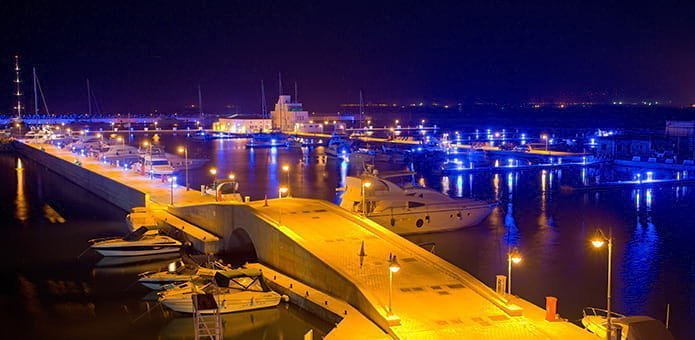 Waterfront homes around Limassol marina at dusk